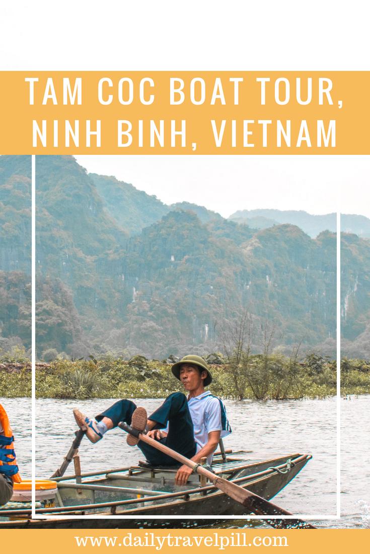 Vietnamese man rowing the boat with his feet in Tam Coc, Vietnam