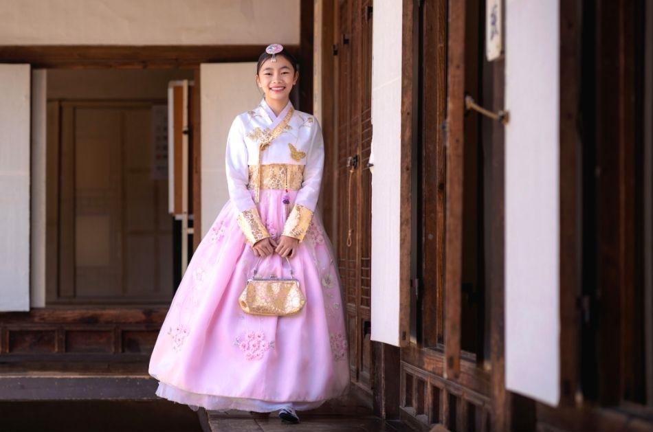 korean girl dressed in pink hanbok