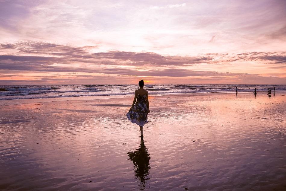 Girl on the beach at sunset in Bali