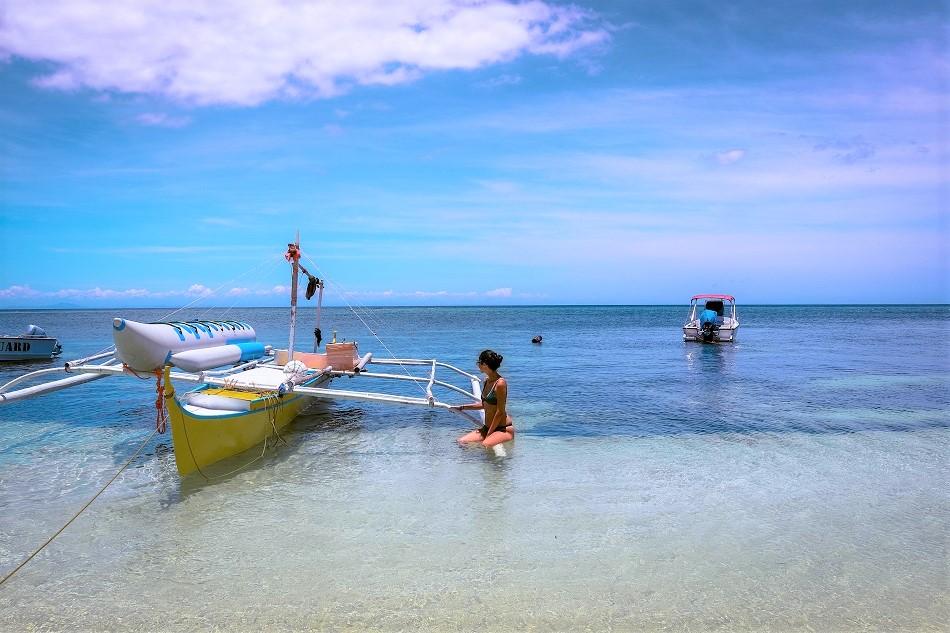 girls on boat at Paliton Beach Siquijor