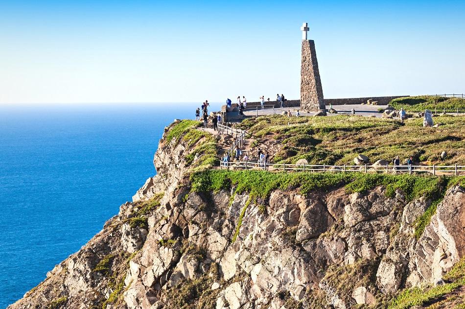 Cabo da Roca stone monument with a cross on top