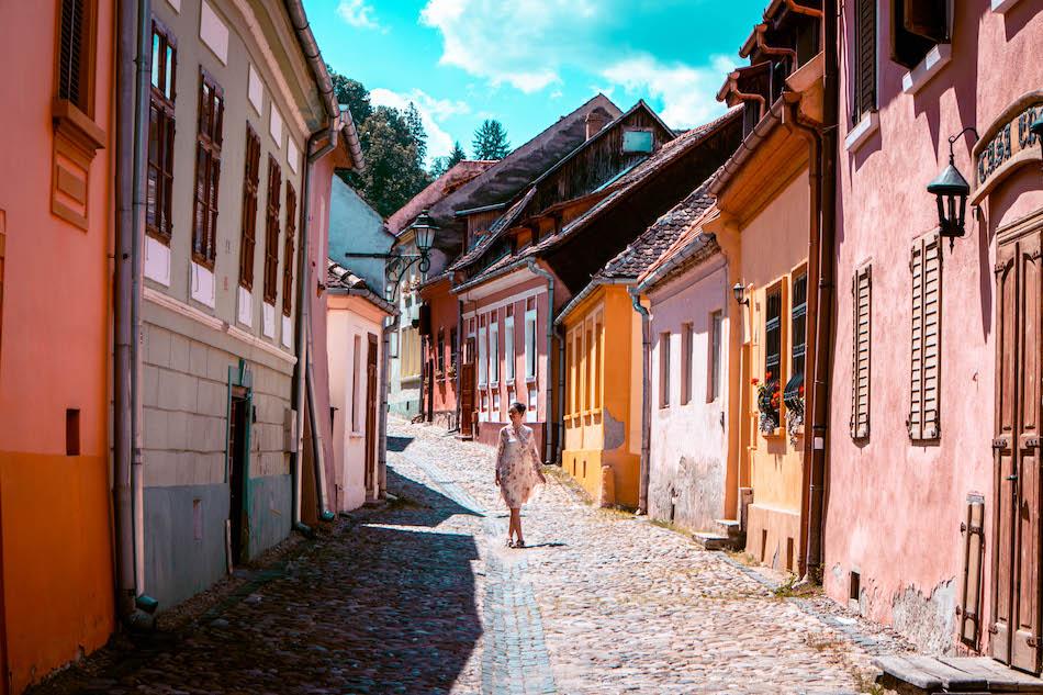 Aurelia Teslaru walking in Sighisoara Fortress Romania