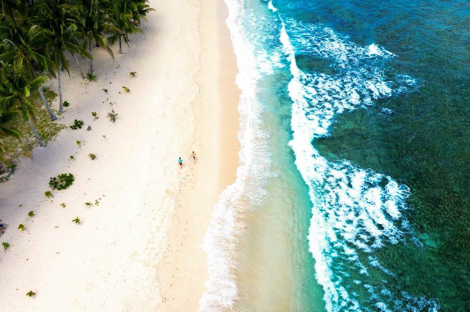 Pacifico Beach Siargao drone view. Palm trees near Pacifico Beach Resort in Siargao, Philippines